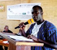 dr emmanuel urey chief of party landesa making remarks on behalf of his organization
