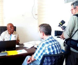 lla executive director stanley n toe being interviewed on the land rights act by a swiss television crew