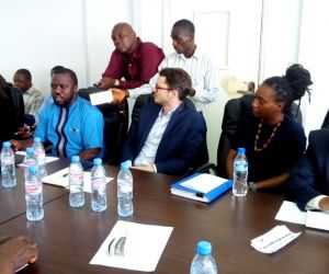 mr george collins of comax ict displaying the features of the website