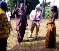 usaid mission director in liberia dr anthony chan and lgsa deputy chief of mission ms lauren dees erickson being briefed by mr jeremiah karmo director